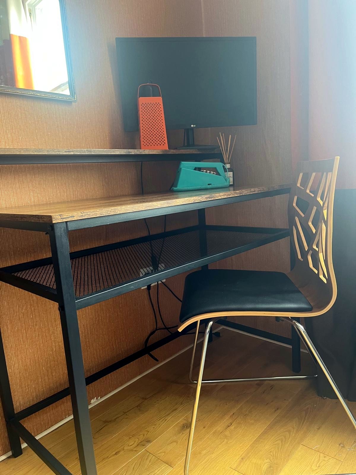 Dedicated workspace with desk, monitor and chair